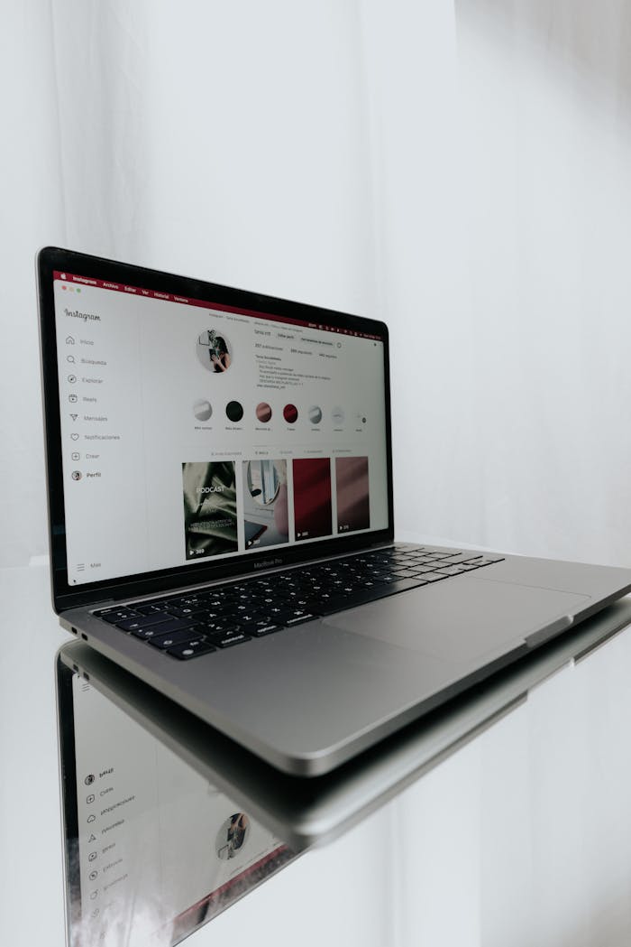 creative-03 Sleek laptop displaying an Instagram profile, showcasing modern technology and online connectivity.