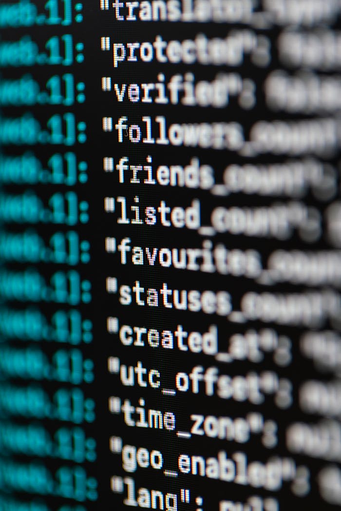mobile-01 Extreme close-up of computer code displaying various programming terms and elements.