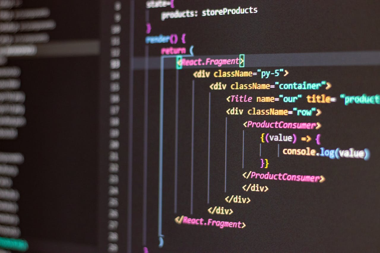 Services-01 Close-up of HTML and JavaScript code on a computer screen in Visual Studio Code.
